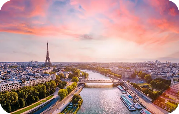 Paris rooftops with Eiffel Tower in background at golden hour